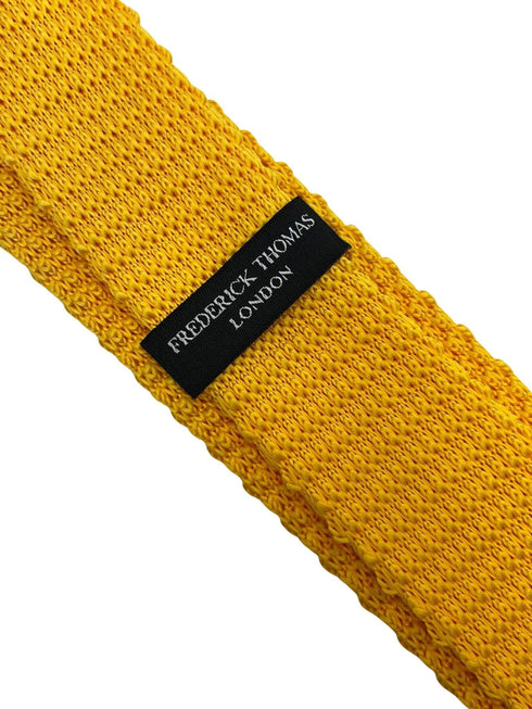 yellow gold knitted with navy blue tip